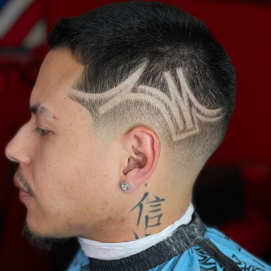 Low Taper Fade with Tribal Design