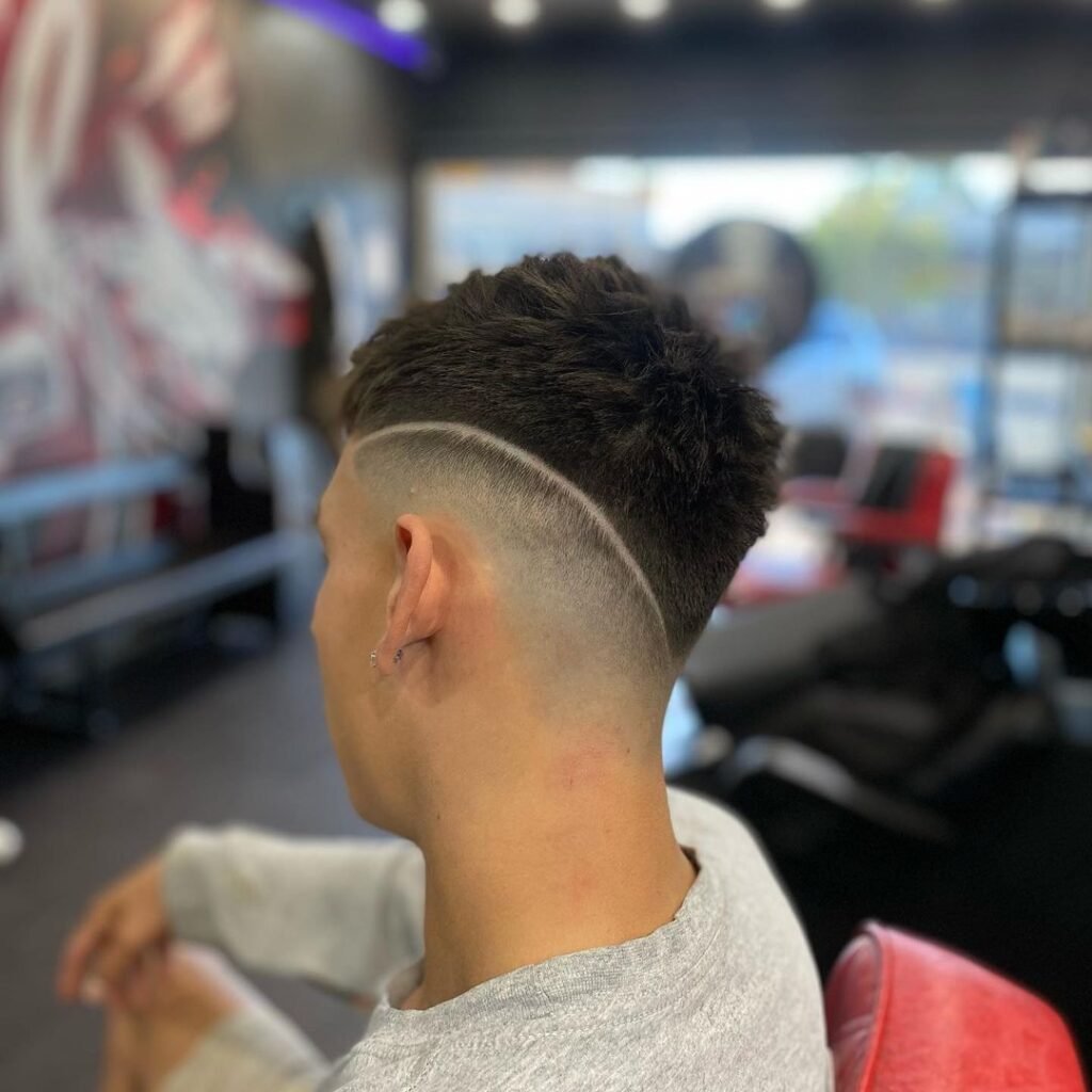 Taper Fade with Side Part and Design