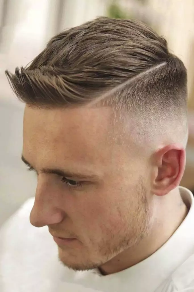 Taper Fade Low with side part comb over